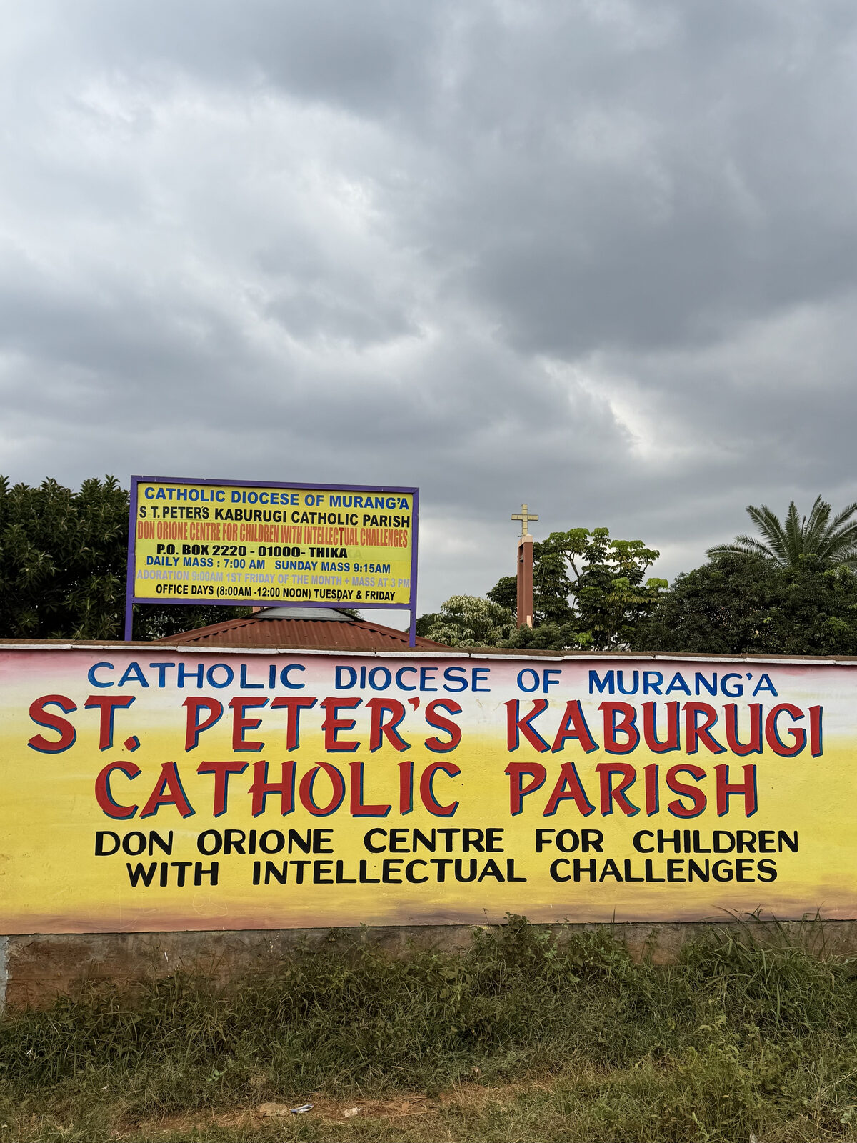 Mass times board at St. Peter's Parish, Kaburugi