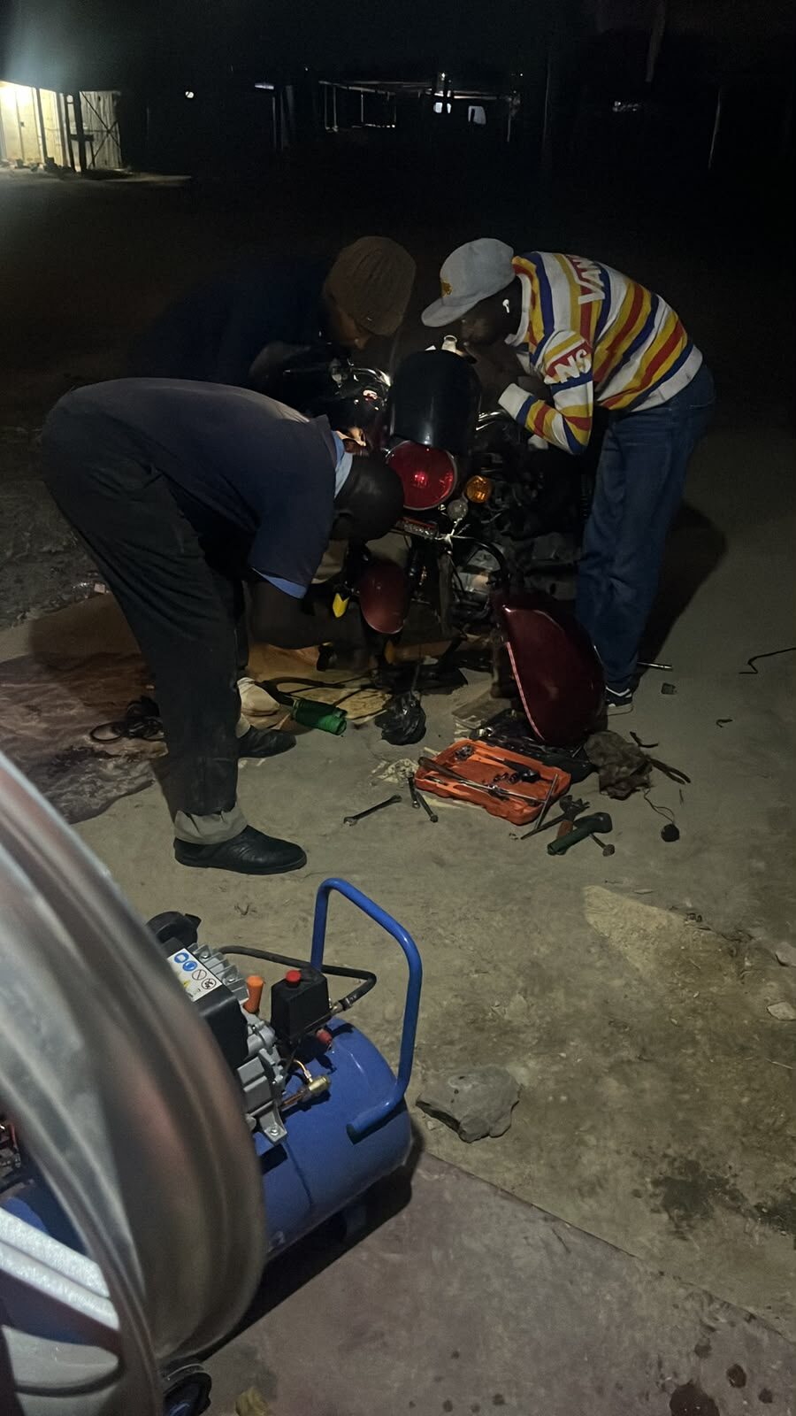 A motorcycle under repair at the Orione Riders Garage